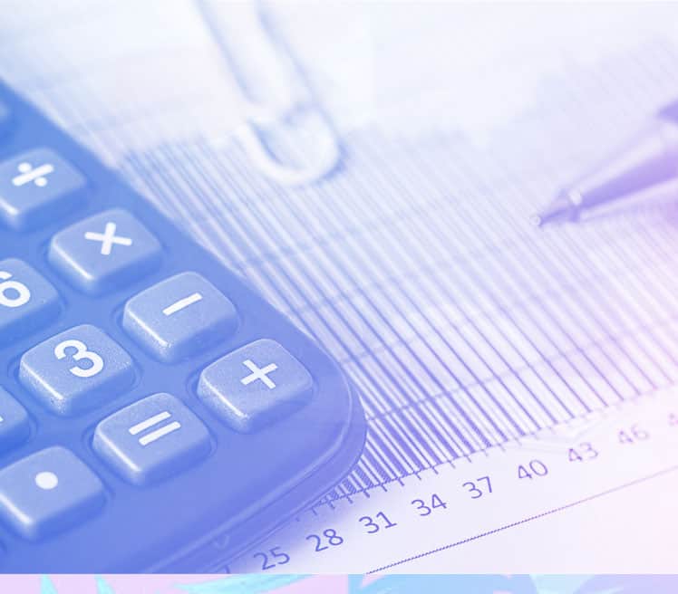 A calculator and pen lying on a document filled with numbers and lines.