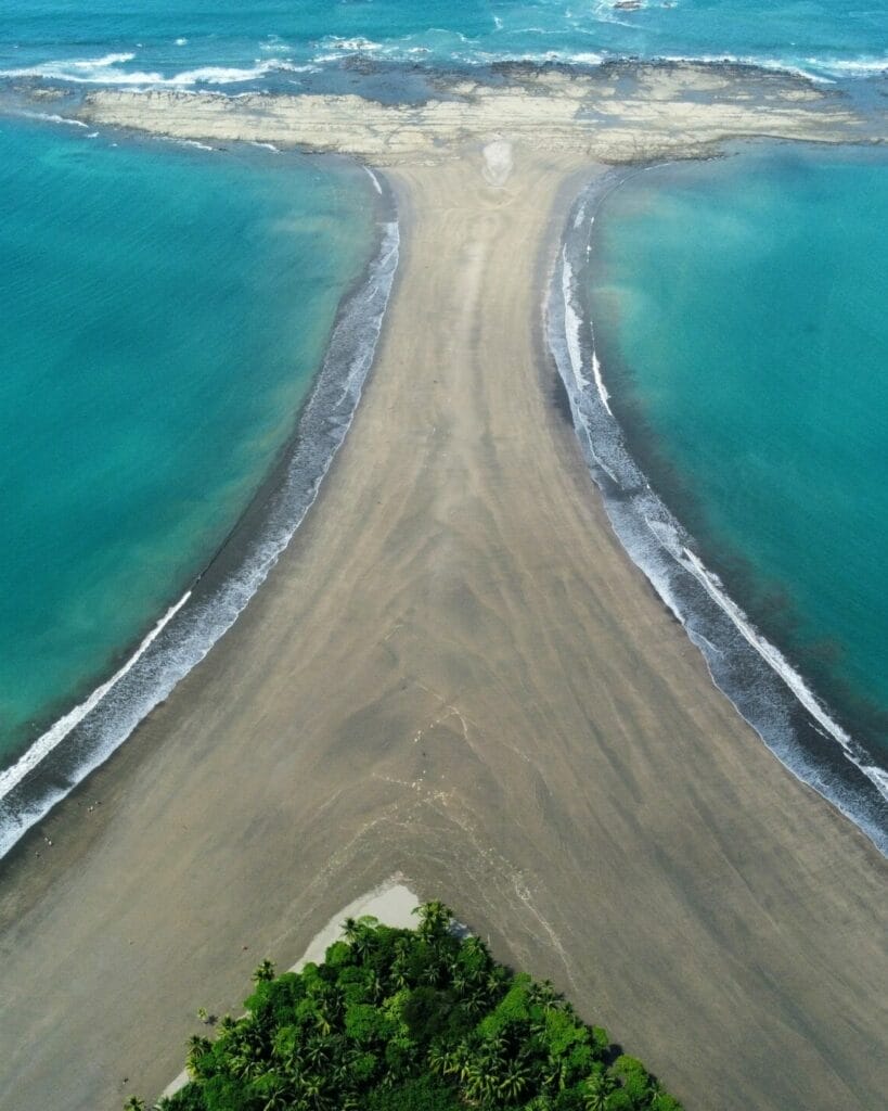 Aerial view of a sandbar dividing two bodies of water in Costa Rica.